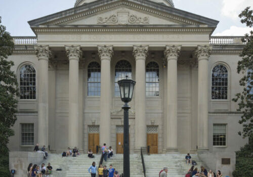 A view of students passing in front of Wilson library.